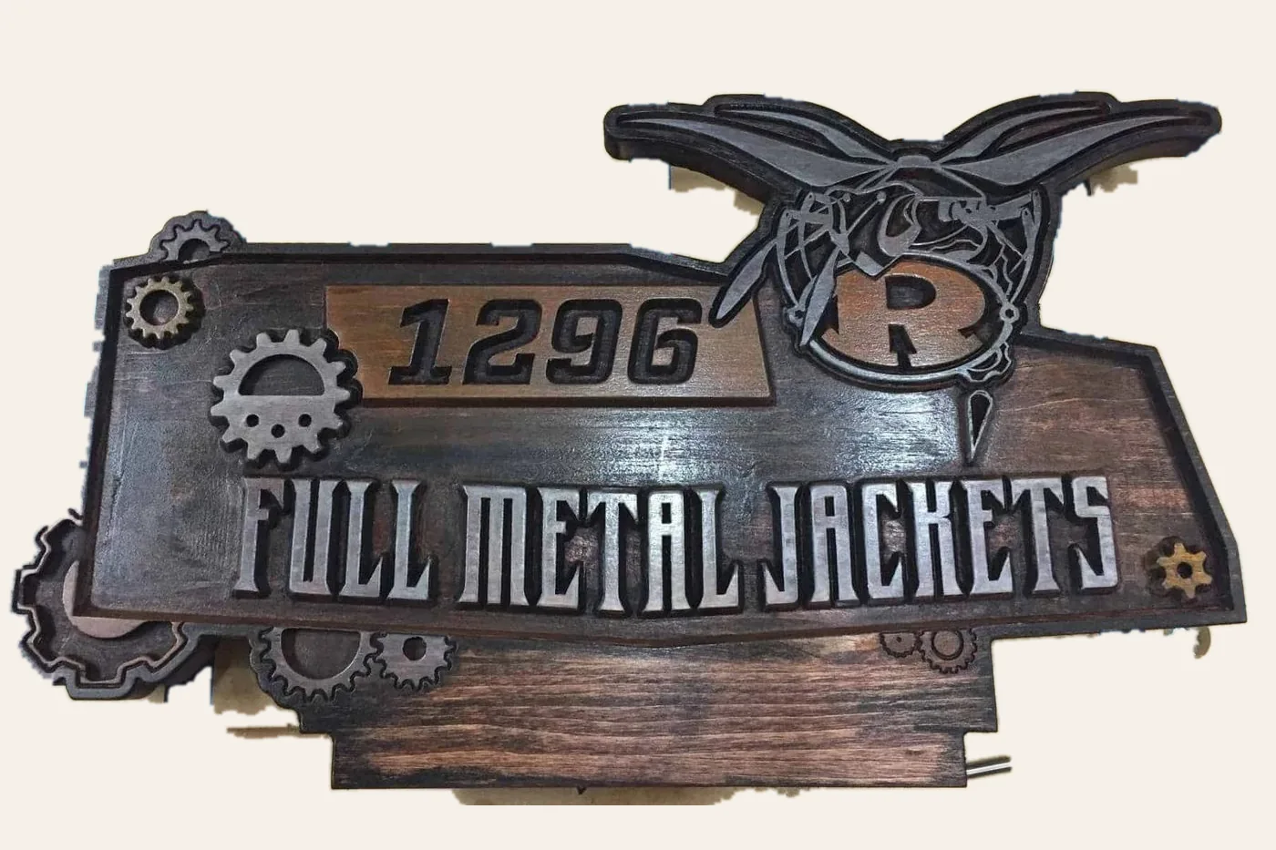 Full Metal Jackets team plaque with a layered emblem and gears