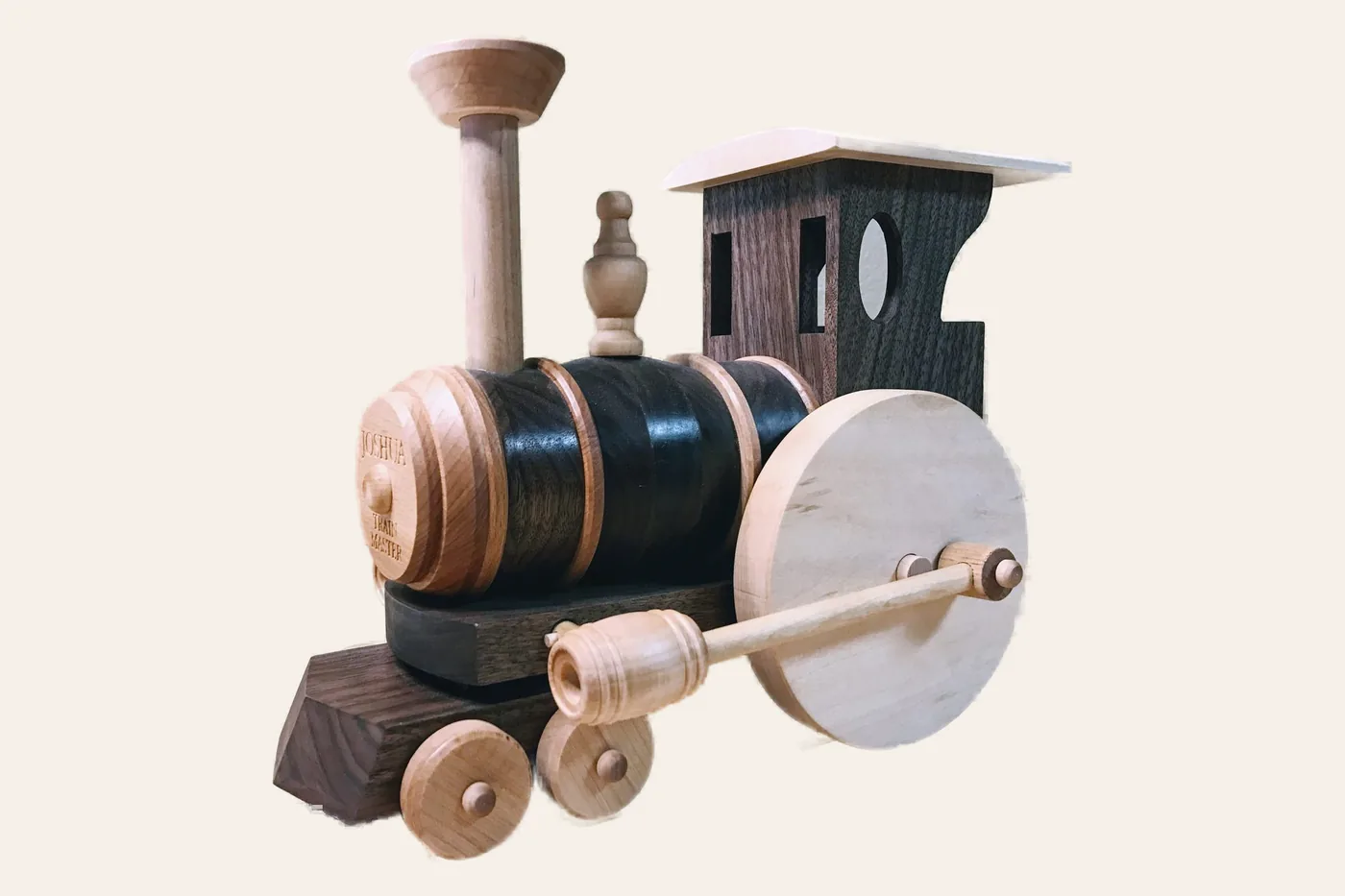 Toy train turned and assembled from walnut, maple and cherry